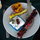 A dessert of grilled fruit & sour cherry ice cream