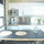 Kitchen with compact fridge, microwave, toaster, coffeemaker, 2 burner stove.