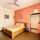 The room has a dressing area and an attached private bathroom 