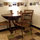 This table can be pulled out  to make it larger.  An extra chair is located in the living room.