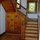 The wood-paneled main staircase just inside the front door.