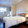 Suite furnished with double bed, workstation and looking west