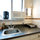 Kitchenette with induction burner, fan, microwave, sink and coffee maker