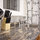 Solid surface countertop complements the deep bowl stainless sink and tin backspash.