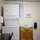 Full-sized washer and dryer in laundry/bath.