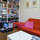 Living room with a good selection of books to read while staying in apartment.