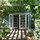 Doorway under the grape-vined trellis