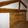 Attic landing with exposed beams and feature bedroom doors