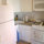 Fully equipped kiitchen with large fridge/freezer, stove, ove, microwave.