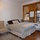 Queen size bed, comfortable wing-back armchair, and 2 big windows facing south - great sunlight!