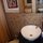 Bathroom sink, mirrors, and close-up of tiles and trim details