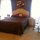master bedroom 2- with attached bath is very large and has vaulted celing, and new wicker furniture