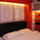 Spanky red master bedroom, accentuated by masterful art deco and view over foregarden and poolside...