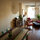 The other view of our living room/dining room, with large dining room table and comfy couch. 