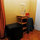 Mini-fridge, kitchen cart and coffee pot.