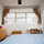 Master bedroom, window to street , chest of drawers & desk