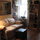 The back living room/dining room. The couch folds out into a single bed.