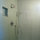 Walk-in spa shower with glass tile