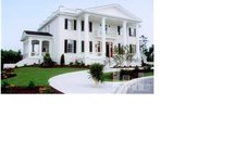 A room in a white house for rent.
