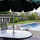 Looking at cabaña, patio, & garden from deck