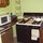 Microwave, under-counter fridge and stove.