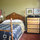 The cozy Little Guest Room has a comfy antique double bed and one large closet.  