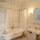 Your private bathroom has a 'rain' showerhead over a clawfoot tub.