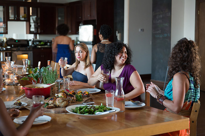 Her dining room table seats 25.
