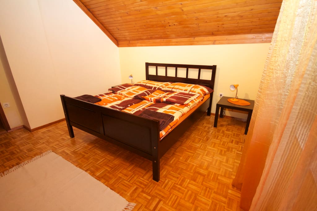 Cozy bedroom with queen size bed and private balcony