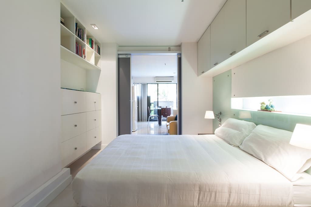 Modern, clean bedroom with cold air conditioning in hot Bangkok