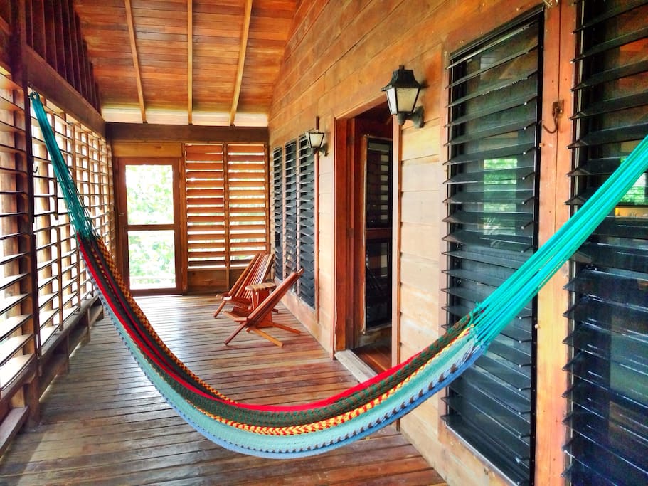 Great screened-in front porch with seating and an extra large hammock. Perfect for catching the evening breeze.