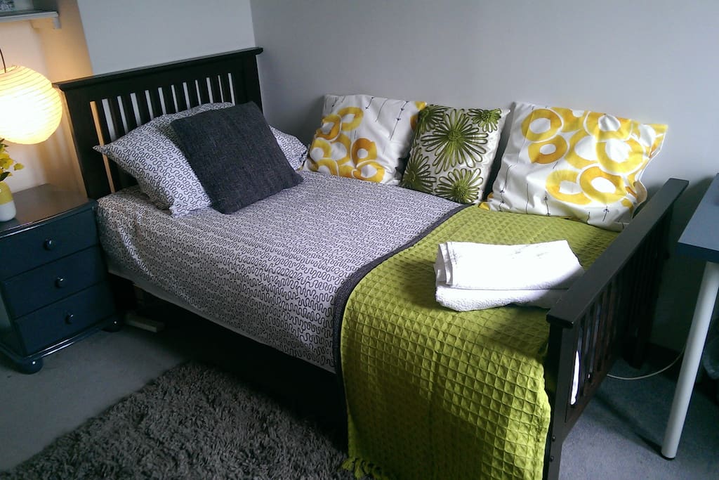 single room with clean towels and linen