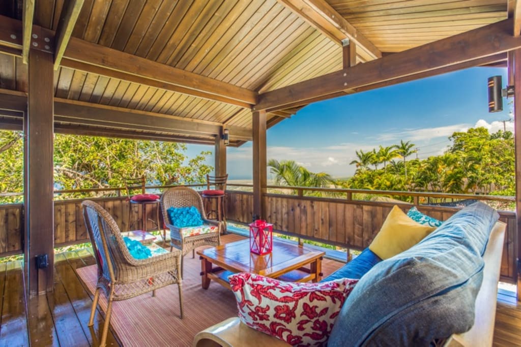 The cottage lanai seating area with large futon couch; view to the northwest.