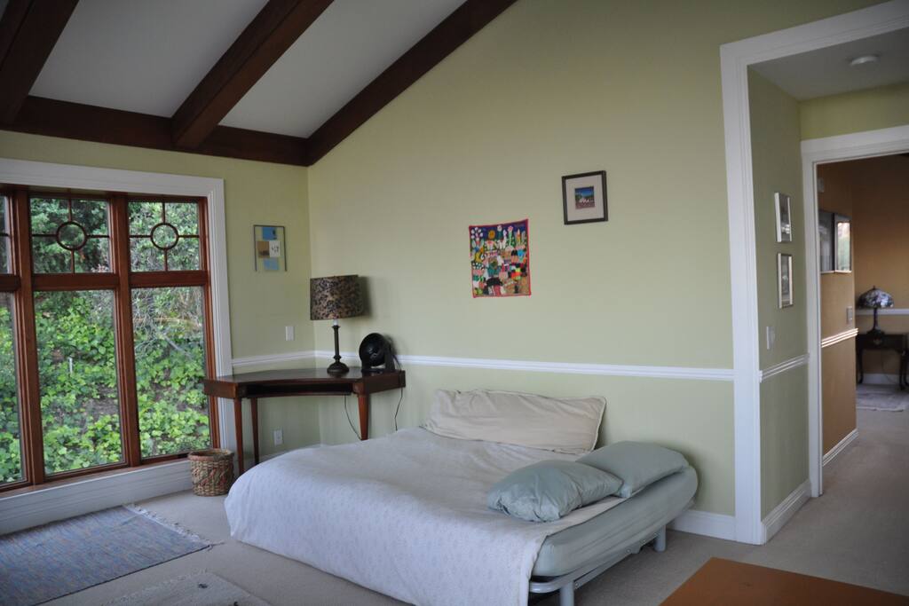 Full size futon bed accommodates two guests.